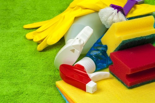 Cleaner polishing windows and frames on a property in Barnet