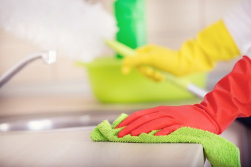 Professional cleaners maintaining desks and shared office spaces in Barnet